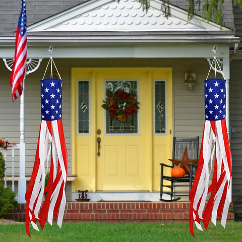 Pair Of 60 Inch American Flag Windsocks With Red White Blue LED Lights For Outdoors Patriotic Fourth Of July Memorial Day Decor 250th Anniversary USA Windsocks Festive Outdoor Display hanging outside a house.