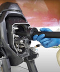 Gimbal bearing alignment/installation tool used on a Mercruiser outdrive; blue-gloved hand inserts a shaft