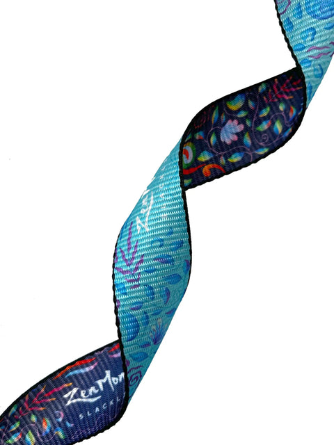 Close-up of blue and patterned two-tone webbing from 1 Inch Slackline Kit With Dual Ratchet System 82 Foot Jungle Line