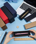 24-Piece Colorful Pen Gift Boxes Set cushioned cardboard boxes for ballpoint and fountain pens on desk with laptop and ruler