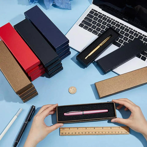 24-Piece Colorful Pen Gift Boxes Set cushioned cardboard boxes for ballpoint and fountain pens on desk with laptop and ruler