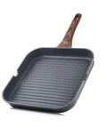 Nonstick Grill Pan For Stove Tops With Pour Spouts, Square 9.5 Inch Griddle, wood handle, angled view.