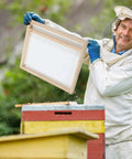 Beekeeper holding Solar Fume Board For Beehives, Universal 8 Frame And 10 Frame Inner Cover With Metal Top