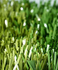 Close-up of green poly synthetic turf from Five By Ten Foot Synthetic Turf Batting Cage Mat For Baseball And Softball Practice.