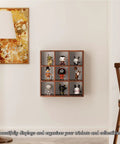 Sleek 9 Grid Wall Mounted Coffee Mug Display Rack, Solid Wooden Curio Shadow Box Shelf, holding collectibles on wall.