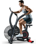 Man using Indoor Upright Air Resistance Fan Bike With Bluetooth, Infinite Air System, dual handlebars, home gym setting