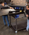 Two people using Elite Bead Roller With 27 Inch Throat Capacity For Floor Pans Firewalls Trunk Floors And Inner Fenders.