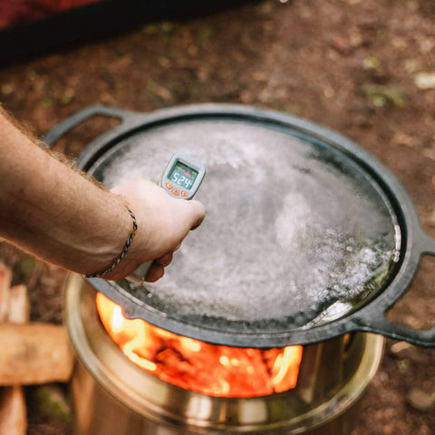 Using No Touch Infrared Thermometer For Cooking And BBQ Laser Temperature Gun With Digital Display over hot grill