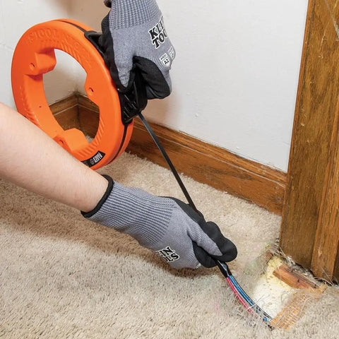 Using Flat Steel Electrical Fish Tape Twenty Five Foot One Quarter Inch Wide Spring Steel With Slim Plastic Tip for wire run