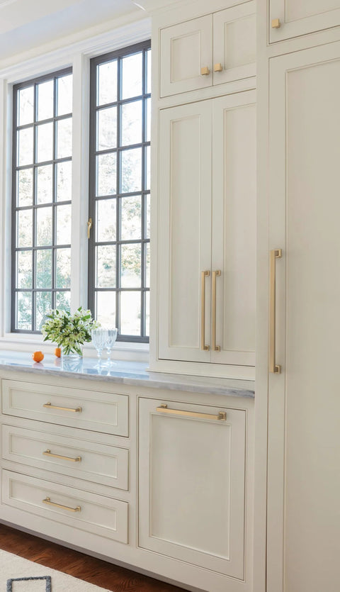 Lintel 18 Inch Center To Center Champagne Bronze Appliance Pull on large white cabinets in kitchen