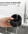 Non Slip Silicone Coffee Tamper Base With Portafilter Holder For Luxe Cafe ES601 ES701 being rinsed in a kitchen sink