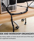 54 Yards Of One Half Inch Reusable Cable Ties For Easy No Fuss Cable Management organizing cords behind a computer desk