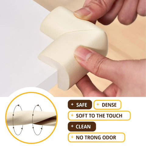 Four Pack Top Tier Baby Proofing Corner Guards With Soft Nbr Rubber Foam And No Sweat Self Stick Backing For Heavy Duty Furniture Edge Safety In Cool Off White, being applied to a table corner.