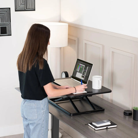 Ultra Slim Single Top Standing Desk Riser Height Adjustable Sit Stand Converter in use by person with laptop