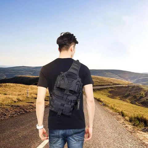 Rugged Tactical Sling Bag Pack Waterproof Rucksack For Travel Hiking Camping Trekking Exploring Fishing Hunting shown outdoors