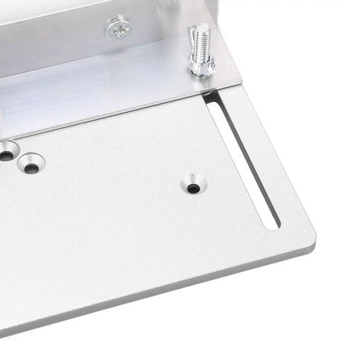 Close-up view of Built Tough Aluminum Router Table Insert Plate With Alignment Rings For DIY Woodworking Benches, showing precise holes.