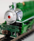 Front view of Prairie 2 6 2 Locomotive and Tender N Scale Green Train Set for Model Railroading on track