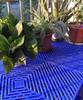 Blue Interlocking Plastic Cargo Pallet With Waterproof Grid And Breathable Design Lightweight Storage for plants.