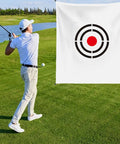 Golfer practicing with Portable Golf Target Cloth For Backyard Driving Range 5 By 6 Foot Hitting Training Aid featuring bullseye