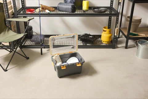 Toss Your Gear In This Heavy Duty 5.28 Gallon Waterproof Plastic Storage Tote Bin with open lid and contents in garage setting.