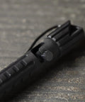 Close-up of All Weather Readiness Metal Tactical Pen With Bolt Action Clicker Glass Breaker Tip Heavy Duty Aluminum Body Black Ink
