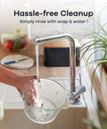 Person rinsing glass bowl from Two Bowls 450W Food Processor With Meat Grinder And Veggie Chopper in kitchen sink