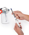 Hands assembling Airless Spray Gun SG3 Pro Kit For Heavy Duty Coatings 3600 PSI Four Finger Trigger With Safety Lock
