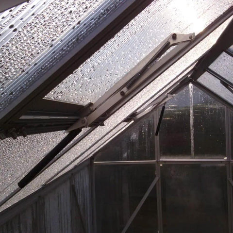 Solar Powered Greenhouse Window Opener, Heat Sensitive Auto Vent Kit with two springs installed in aluminum frame