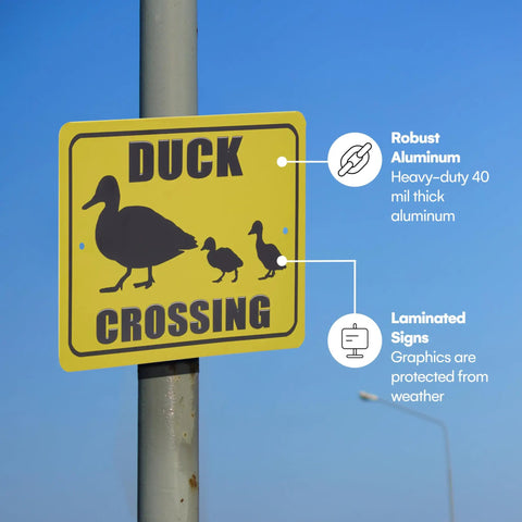 Duck crossing sign, robust reflective aluminum, weather-protected graphics, mounted on pole for road safety in neighborhoods.