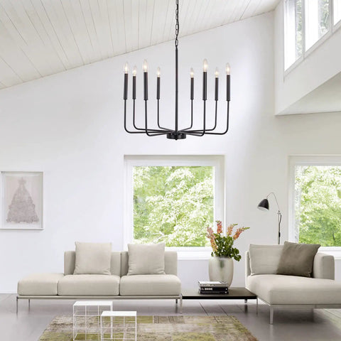 Dope Black Farmhouse Dining Room Chandelier With Adjustable Height Eight Candle Arms Pendant Light Fixture For Living Room Kitchen Island And Foyer Modern Matte Black Metal Lighting hanging in a modern living room.