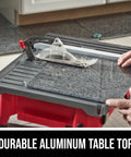 7 Inch Wet Tile Saw With HydroLock Water Containment System for No Mess Cuts, sliding side extension shown on a durable aluminum table top