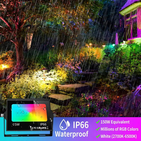 4 Pack RGB LED Flood Lights With Stake Outdoor Color Changing Party Lights illuminating garden in rain 150W Equivalent.