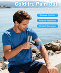 Man using Mini Massage Gun With Heat And Cold Therapy For Deep Tissue Muscle Relief Silent Portable Handheld Percussion Massager outdoors by sea.
