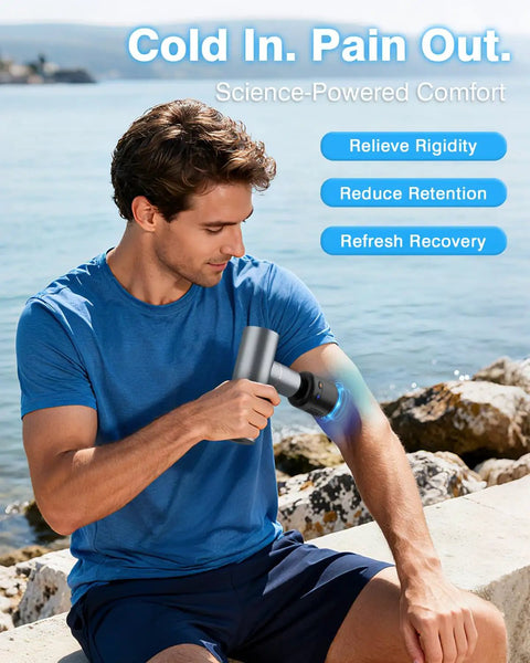 Man using Mini Massage Gun With Heat And Cold Therapy For Deep Tissue Muscle Relief Silent Portable Handheld Percussion Massager outdoors by sea.