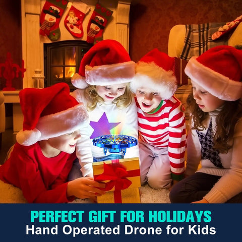 Children in Christmas hats playing with Hand Operated Kids Drone With AI Motion Sensor, Rechargeable Mini Quadcopter That Auto Hover