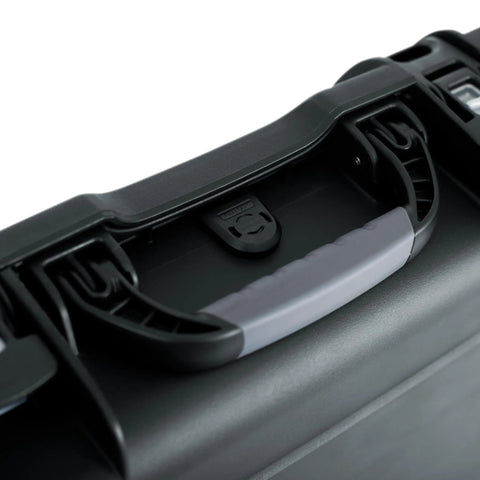 Titan Series Beefy Waterproof Bass Guitar Case for Jazz and Precision Styles IP67 Dustproof and Water Resistant Right Handed Lightweight NK-7 Resin Build ATA-300 Certified for Tough Travel black handle close-up