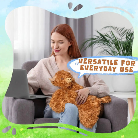 A woman using a laptop with Weighted Highland Cow Lap Pad For Relaxation And Chill, 5lb Sensory Plush Blanket For Naps on her lap.