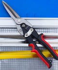 4 Piece Tin Snips Set For Cutting Metal Sheets With Aviation Snips Left Right Straight And Long Heavy Duty Forged Blade Built From CRV Steel Tough As Nails Cutting Tool For Carbon Steel Up To 1.2mm, displayed on metal sheet with red and black handles.