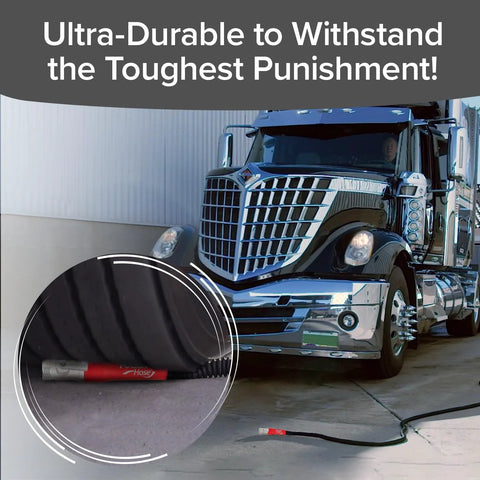 Pocket Hose 50 ft expandable garden hose with red end connector, coiled on ground beside a large truck.
