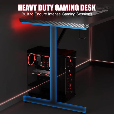 Side view of 55 Inch Gaming Desk With LED Lights And Large Mouse Pad For Home Office, T Shaped Carbon Fiber Surface PC Game Workstation.
