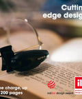 Rechargeable Reading Light Clip On For Glasses Or Headphones With LED Book Light, Headband Included, Award Winning Clip On Design, Made In Germany, Protective Case Included, The Ultimate Nighttime Reading Accessory shown on a book.