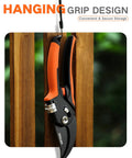 Eight Point Five Inch Stepless Handle Pruning Shears Bypass Garden Clipper hanging on a hook, bright orange handle.