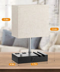 Set Of 2 Dimmable Beige Bedside Lamps With USB C Ports And Dual Charging Outlets shown on a wooden base with phone stand.