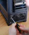 Installing Premium M5 X 12mm Phillips Flat Head Computer Case Fan Screws Kit into PC case for secure fit.