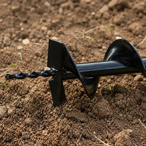 Close-up of Six Inch Replacement Auger Bit for Post Holes on soil, showing heavy duty steel and three-quarters inch shaft
