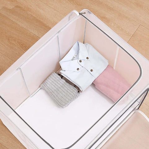 Huge 80L Foldable Storage Bins Organizer With Metal Frame And Durable Handles Clear And Gray 3 Pack For Clothes Bedding Toys And More Waterproof Stackable Tote Boxes With No Assembly Needed showing clothes neatly inside