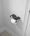 Oil Rubbed Bronze Wall Mount Toilet Paper Holder With Shelf And Phone Slot in bathroom installed next to the toilet