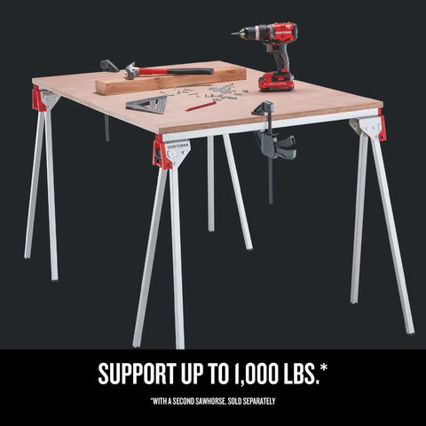 Heavy Duty Metal Sawhorse With Folding Legs, 1,000 Lb Per Pair Load Capacity in use with tools on worktop for stability