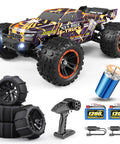 Brushless Monster RC Truck 1/16 Scale 4x4 All Terrain Off Road Racer with spare paddle tires and accessories displayed
