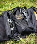Open tool pack on grass showing contents for Handlebar Jack Portable Repair Stand V3 for E Bikes Bundle With Accessories